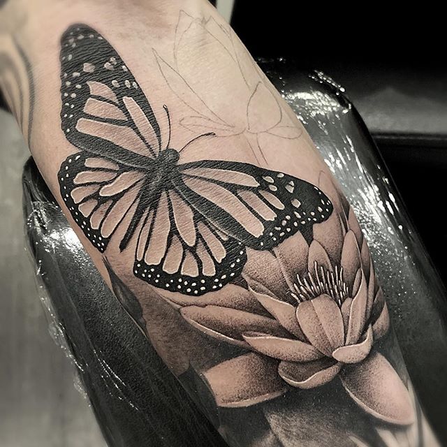 Black and Grey butterfly and Lotus Flower tattoo done by tattoo artist Alan Lott of Sacred Mandala Studio in Durham, NC.