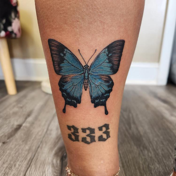 Tattoo Artist Britney Farmer tattoo in full color - blue butterfly