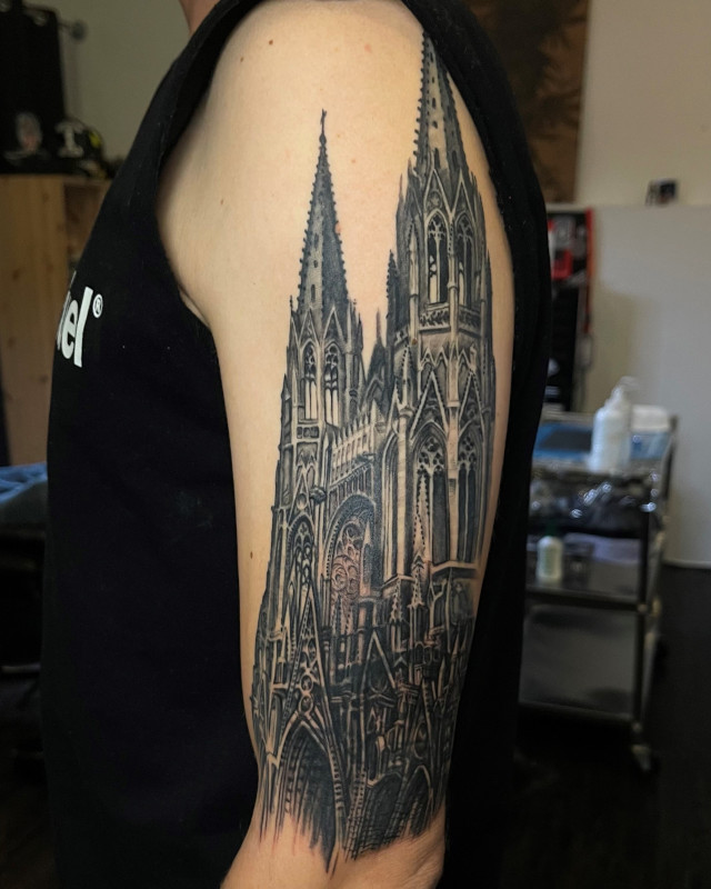 Fine lien black and grey tattoo of a gothic cathedral by Shaine Smith of Sacred Mandala Studio.