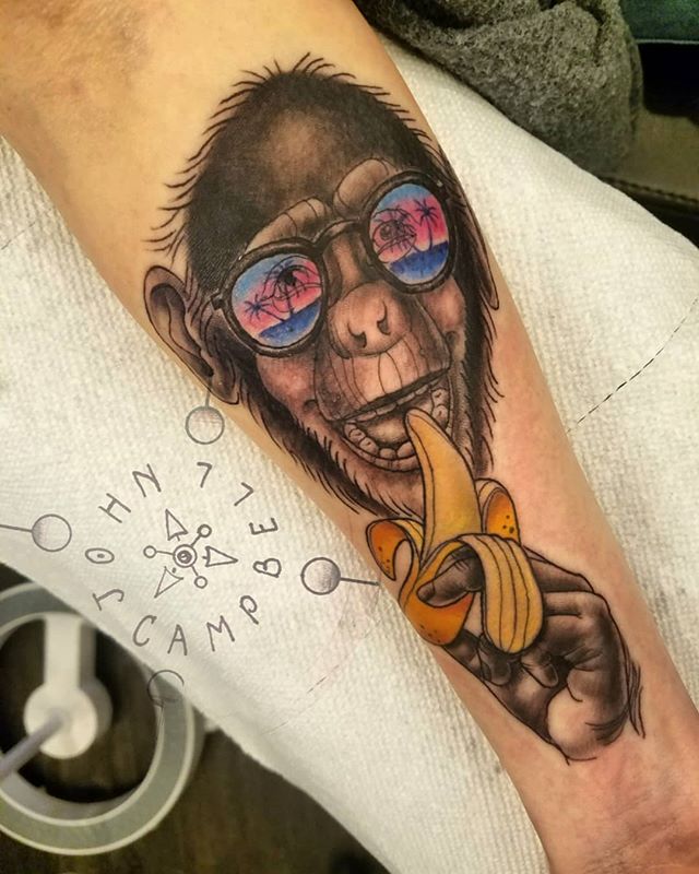 Chimp in sunglasses tattoo by John Campbell at Sacred Mandala Studio tattoo parlor in Durham, NC.