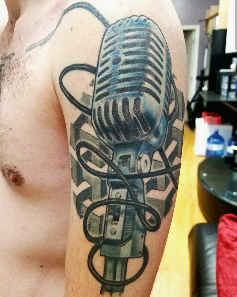 Color Tattoo of Microphone at Sacred Mandala Studio by Tattoo Artist John Campbell.