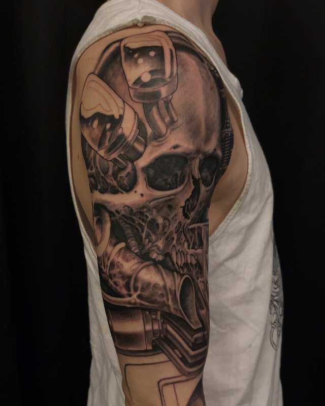 Metal robot machine skull tattoo done in fine line black and grey ink by Shaine Smith of Sacred Mandala Studio.