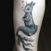 First tattoo ever tattooed at Sacred Mandala Studio - Squirrel Mermaid Unicorn tattoo by tattoo artist Alan Lott done in partial color.