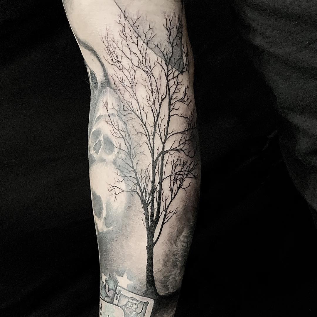 Forearm Tattoo of a Tree in Shadow done in Black and Grey by Tattoo Artist Alan Lott. Tattoo created at Custom Tattoo Parlor and Art Gallery in the Triangle of North Carlina (Raleigh, Durham, Chapel Hill), Sacred Mandala Studio.