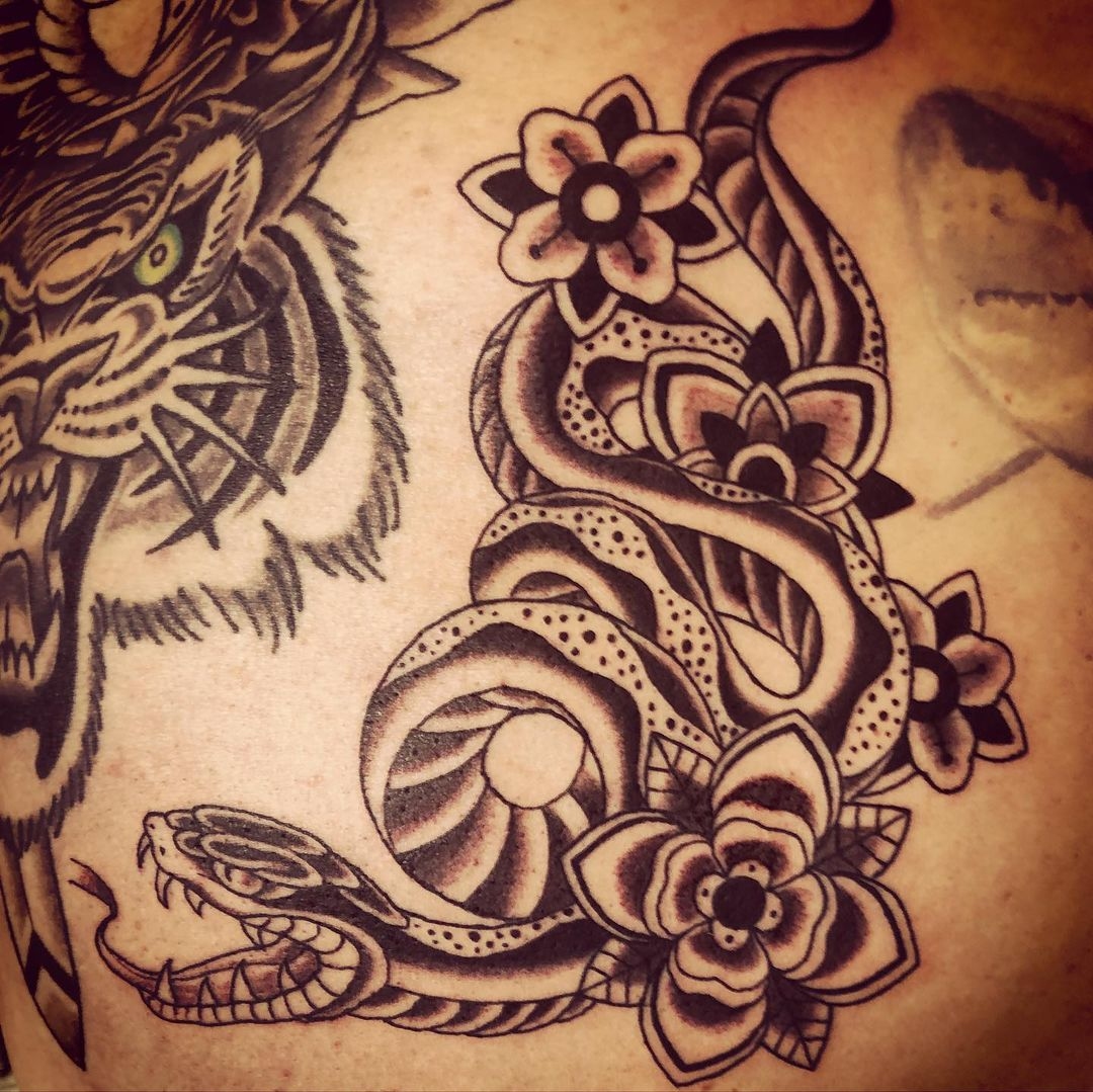 Black and grey serpent. Book a custom tattoo with Chris at Sacred Mandala Studio - Durham, NC.
